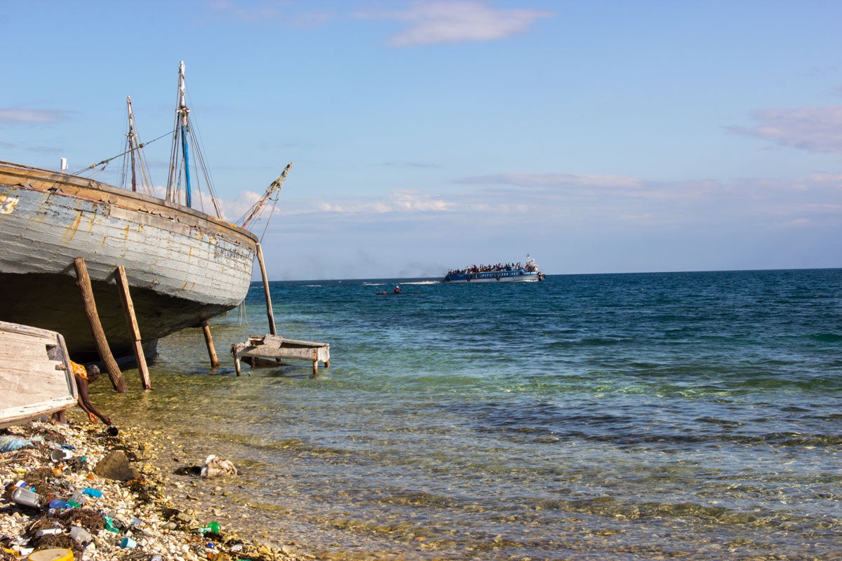 A ferry crosses the sea from La Gonave to the Haitian mainland